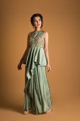 asymetrical peplum with draped skirt