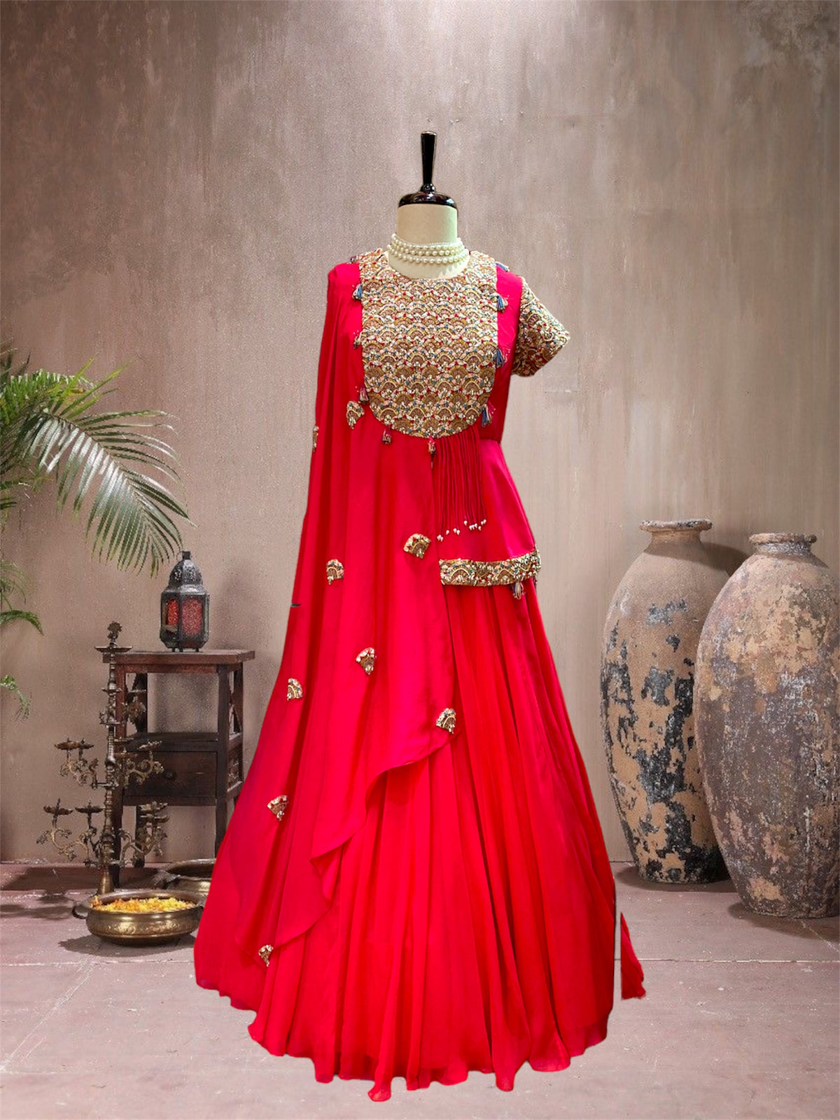 red peplum cape lehenga set.